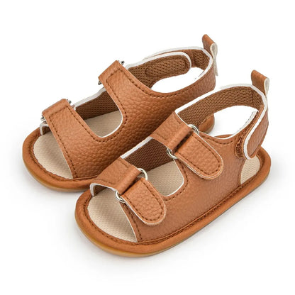 Warm cognac brown vegan leather baby sandals with a rich toffee-colored upper and durable rubber sole.