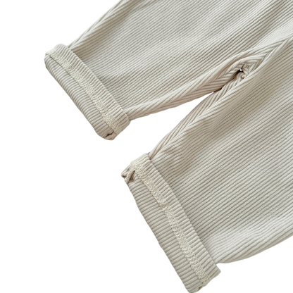 Close-up detail of the rolled pant cuffs and textured ribbed corduroy fabric on Kidsely toddler overalls.