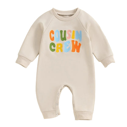 Cream full-length baby sweatshirt romper with colorful Cousin Crew embroidered lettering