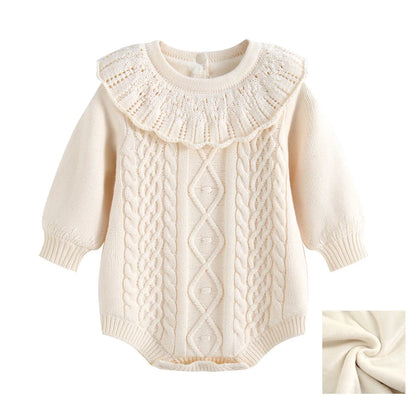 Cream baby girl cable knit ruffle romper showing inset of warm plush fleece lining.