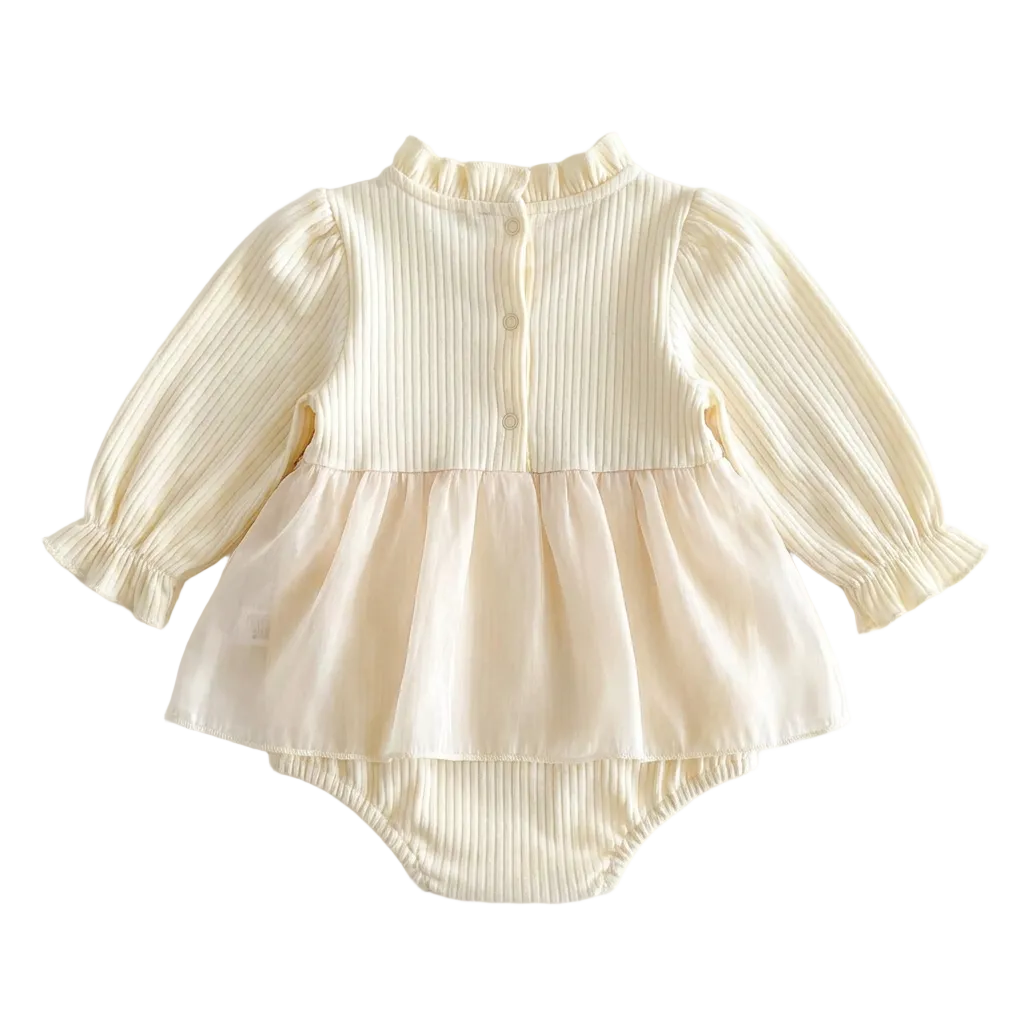 Full back view of a baby girl's cream long-sleeve ribbed romper dress showing the back button closures and tulle skirt.