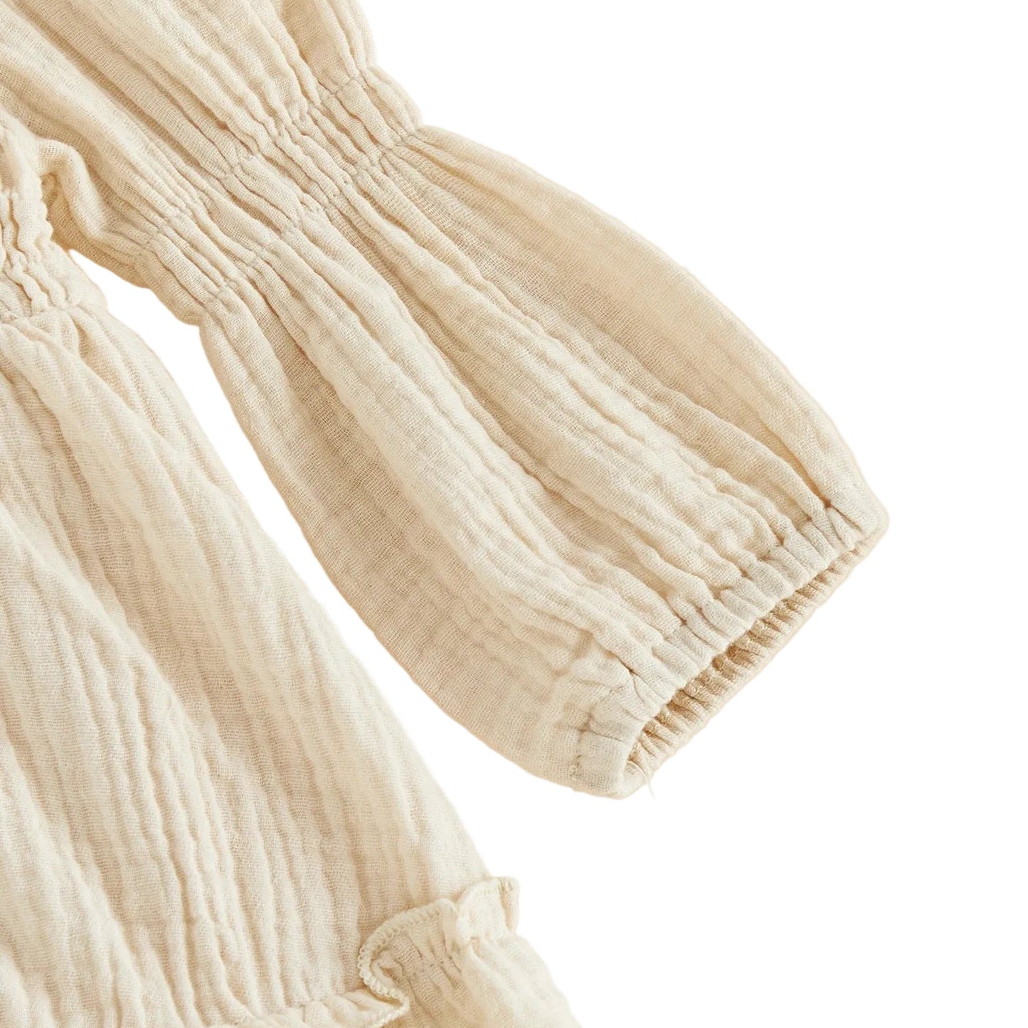 Close-up detail of the long balloon sleeve and gathered ruffled cuff on the cream goose baby romper.