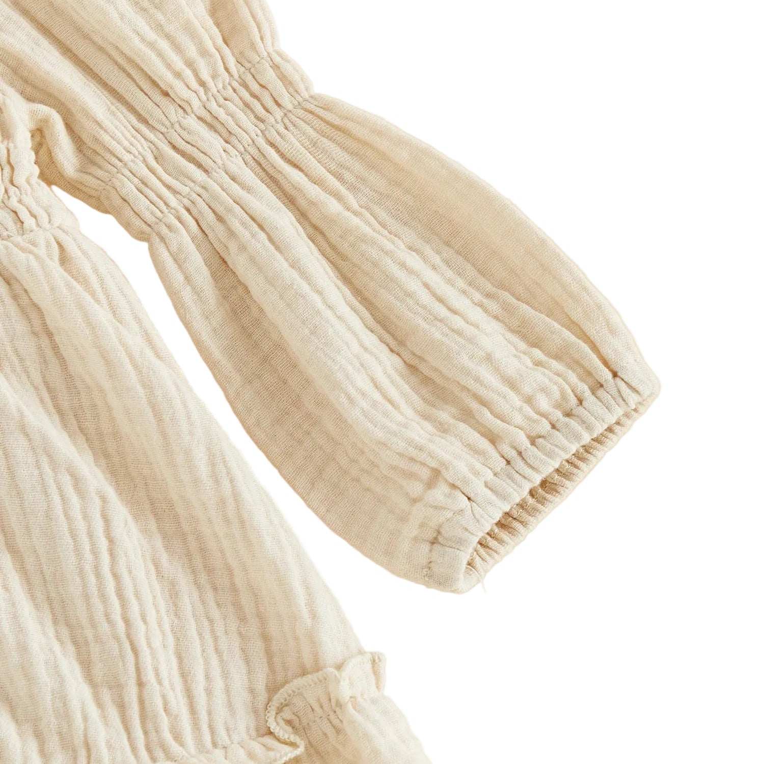 Close-up detail of the long balloon sleeve and gathered ruffled cuff on the cream goose baby romper.