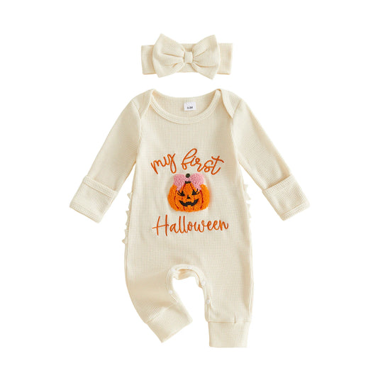 Cream-colored ribbed long-sleeve baby romper featuring a "My first Halloween" pumpkin design, paired with a matching bow headband.