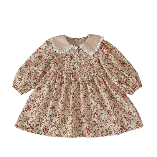 Full front view of the toddler and girls cream vintage floral long-sleeve dress featuring a gathered waist and lace-trimmed Peter Pan collar.
