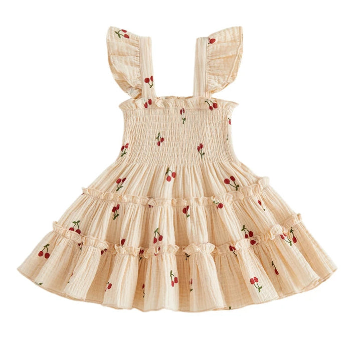 Kidsely Baby and Toddler Girl Smocked Cherry Summer Dress in Creamy Vanilla with flying sleeves and tiered ruffle skirt.