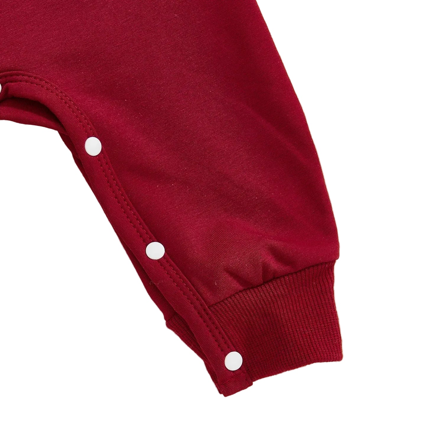 Close-up of the robust inner leg snap closures on the crimson baby jumpsuit, designed for quick and easy diaper changes