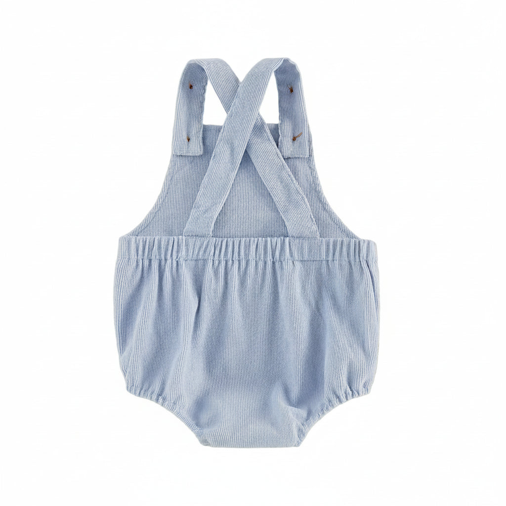 Back view of the baby 4th of July flag romper showing the convertible cross-back straps and elasticized waistband.