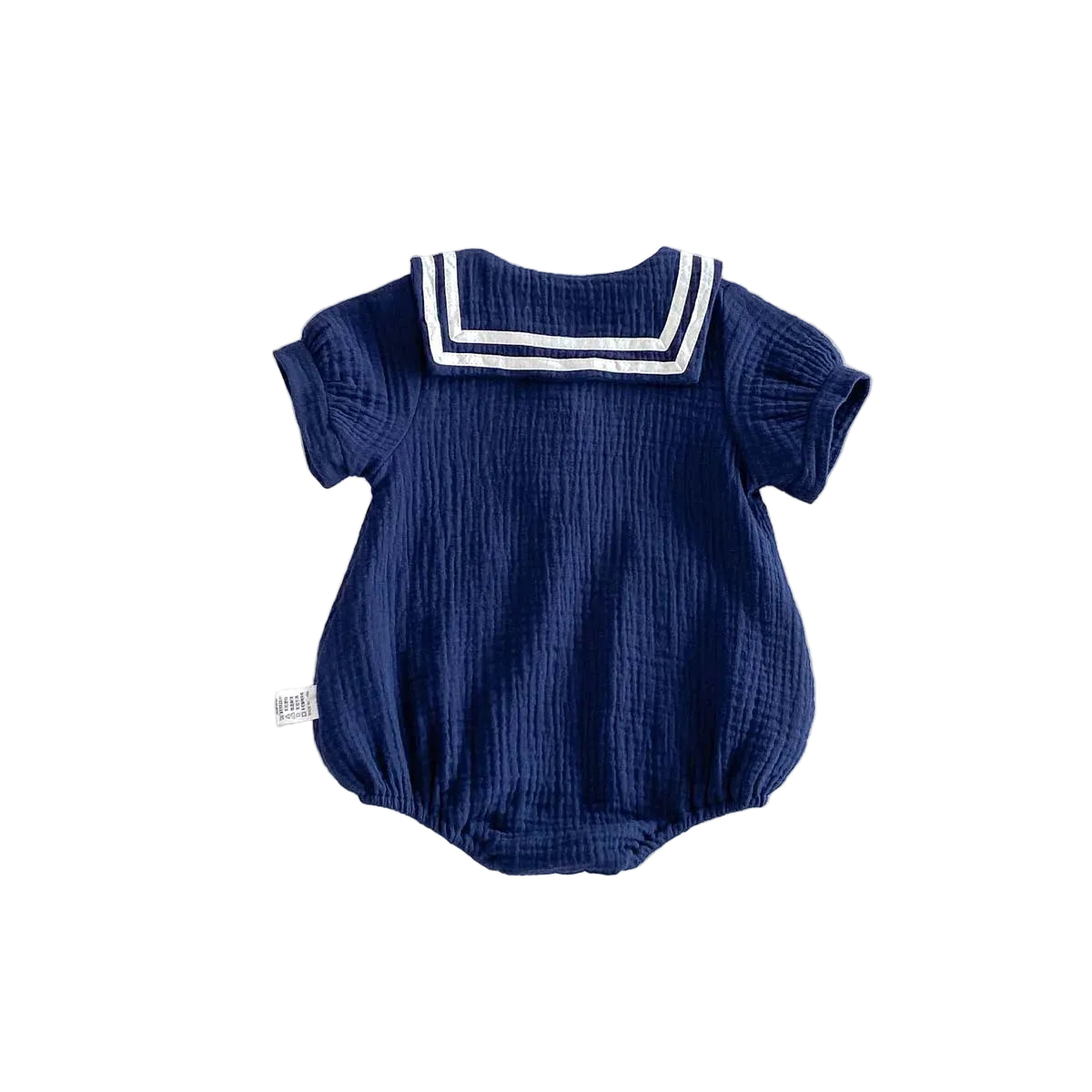 Back view of the Deep Sea navy blue muslin bubble romper showing the wide sailor collar flap.