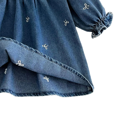 Close up of the dress hem folded up to show the lighter underside of the 100% cotton denim twill fabric.