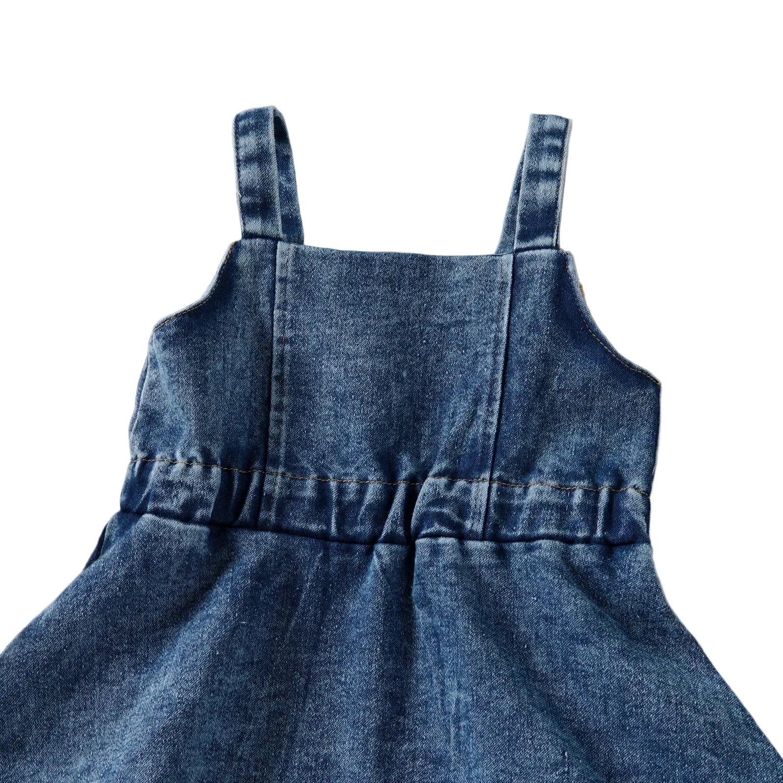 Close-up of the back of the denim overall dress showing the comfortable elastic gathered waistband.