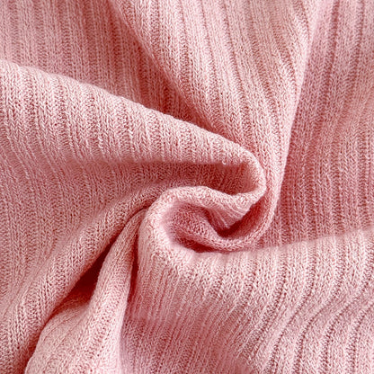 Detailed close-up of the soft, swirled dusty rose ribbed knit polyester fabric, showing the stretchy summer-ready clothing material texture.