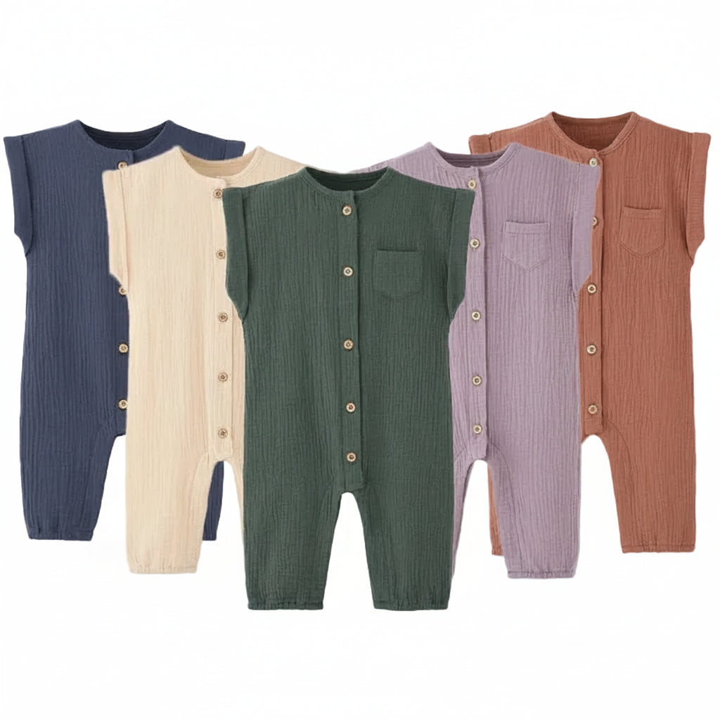 ollection of neutral baby fall clothes showing the cotton muslin infant jumpsuit in navy, cream, sage green, lavender, and rust colors.