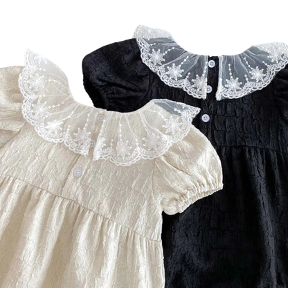 Back view of the Eleanor baby rompers showing the neat button closures and elegant lace collar overlay.