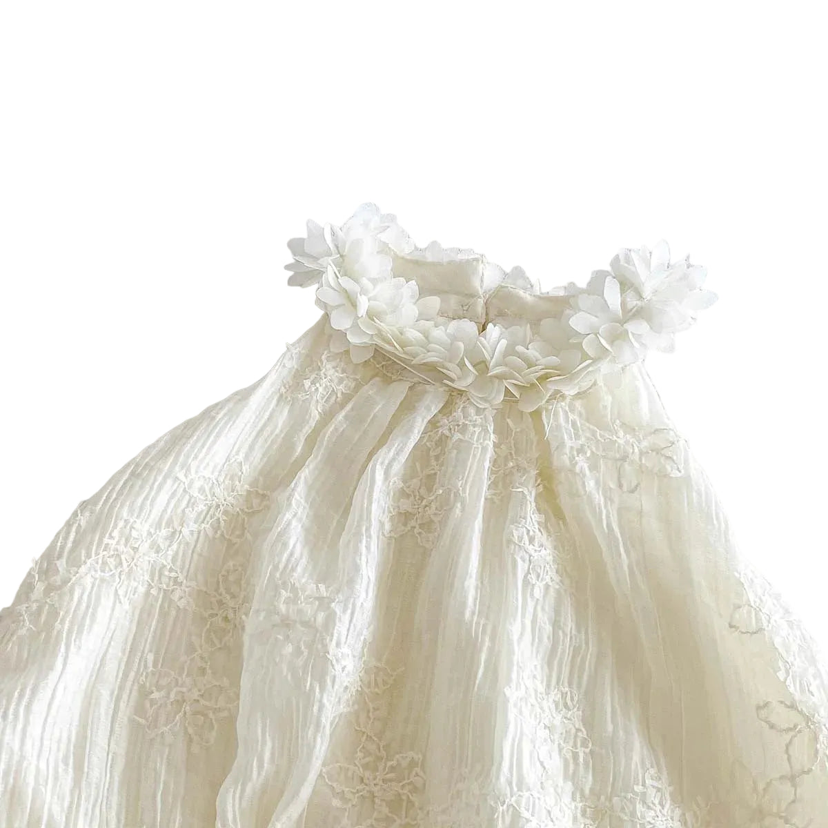 Close-up of the elegant 3D floral applique neckline on the white boho baby romper.