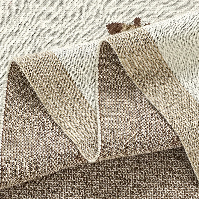 Close-up showing the breathable knit texture and neatly finished edges of the baby blanket