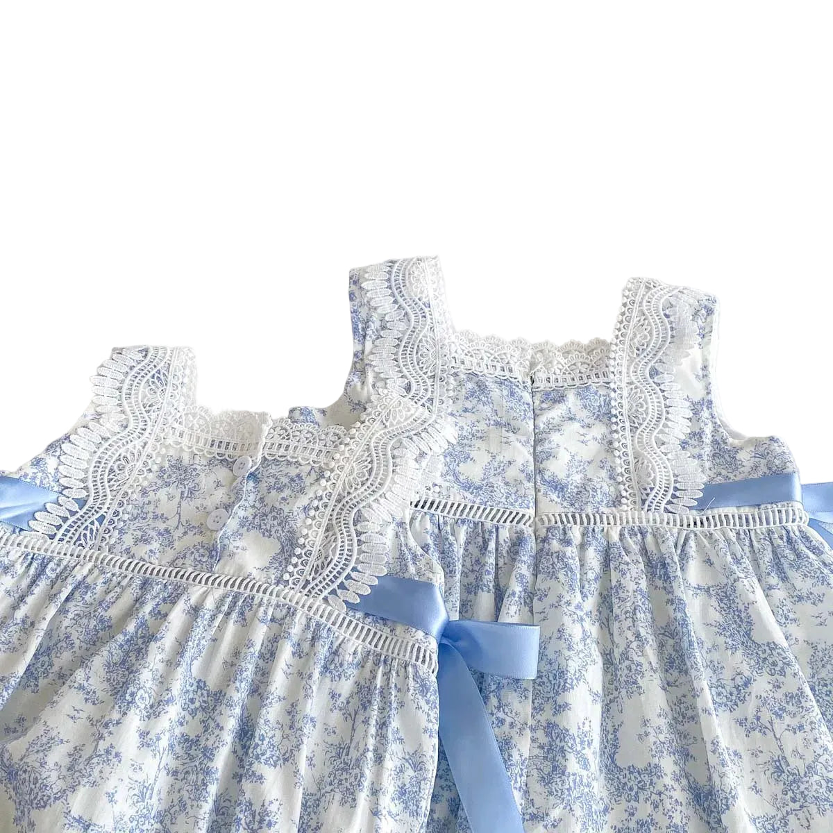 Back view of the blue floral special occasion dress showing the button closure and lace detailing.