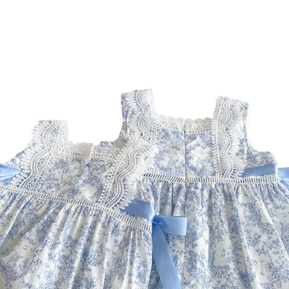 Back view of the blue floral special occasion dress showing the button closure and lace detailing.