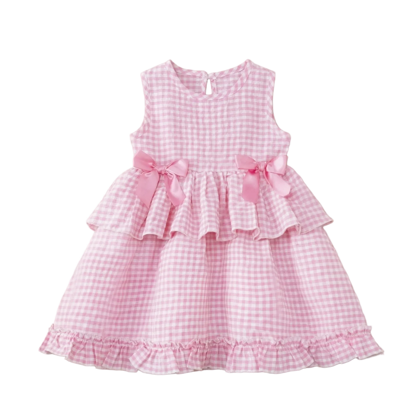 Flat lay of a girls sleeveless candy pink and white gingham dress with a tiered ruffle skirt and matching pink satin bows, styled for a 2026 summer pastoral aesthetic.