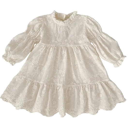 Front view of girls ivory floral embroidered cottagecore dress with long bishop sleeves and tiered A-line skirt.