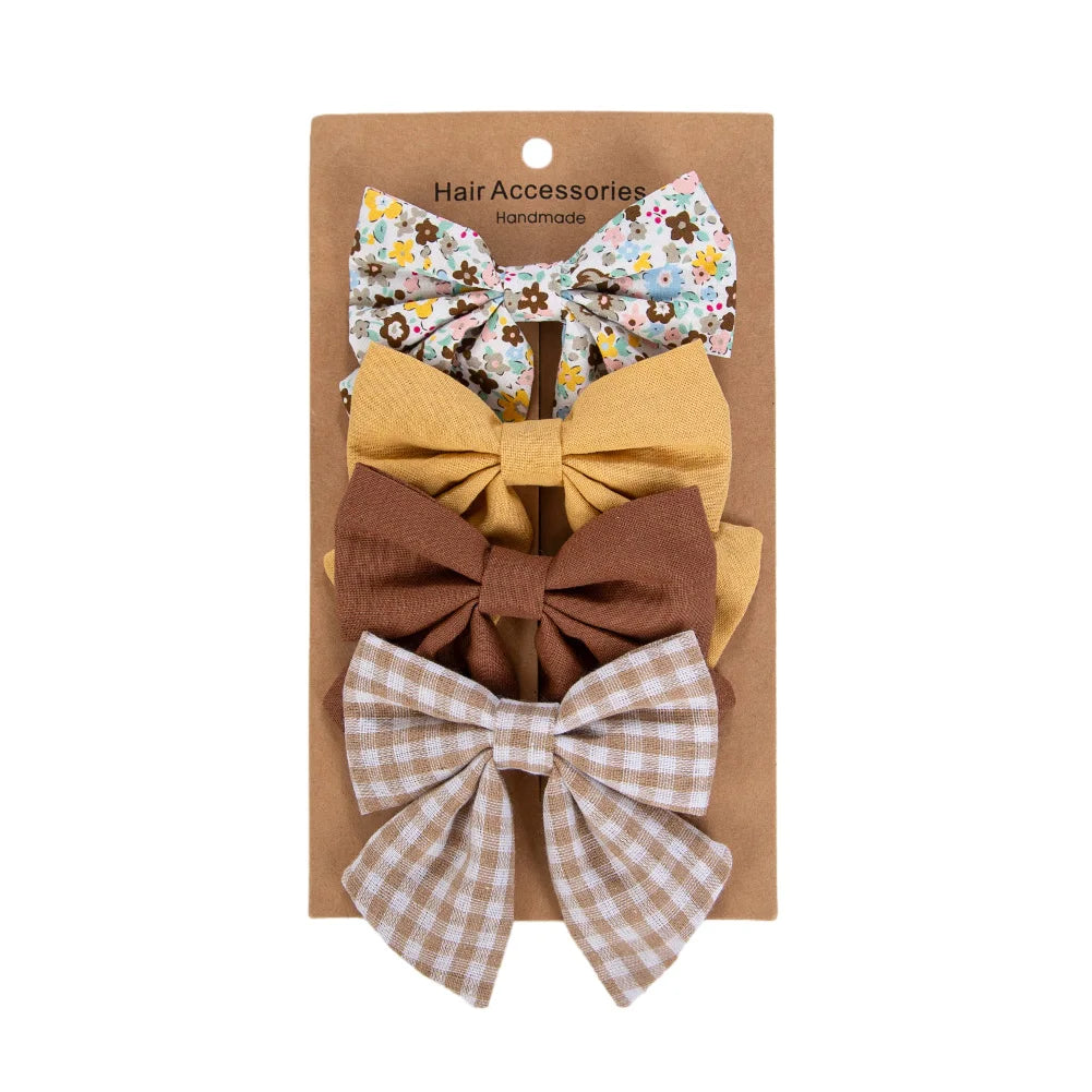Kidsely Golden Harvest set of 4 large bows in mustard gold, chocolate brown, tan gingham, and floral prints.