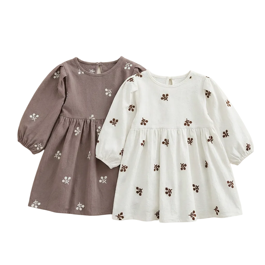 Flat lay showing both the gray and white color options of the long-sleeve floral embroidered girls dress.