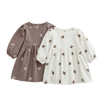 Flat lay showing both the gray and white color options of the long-sleeve floral embroidered girls dress.