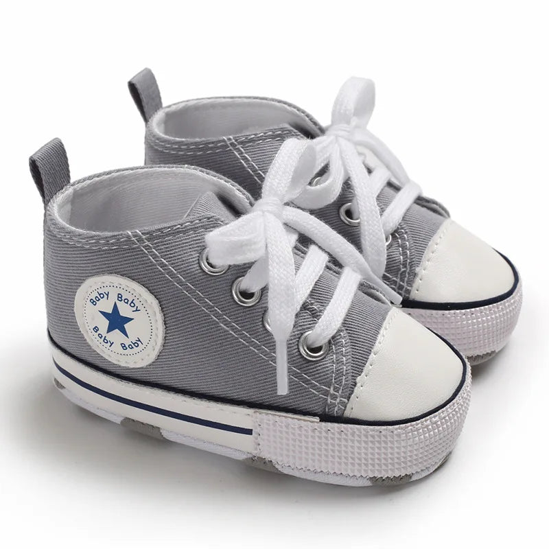 Heather gray unisex baby canvas high-top sneakers with traction grip soles.