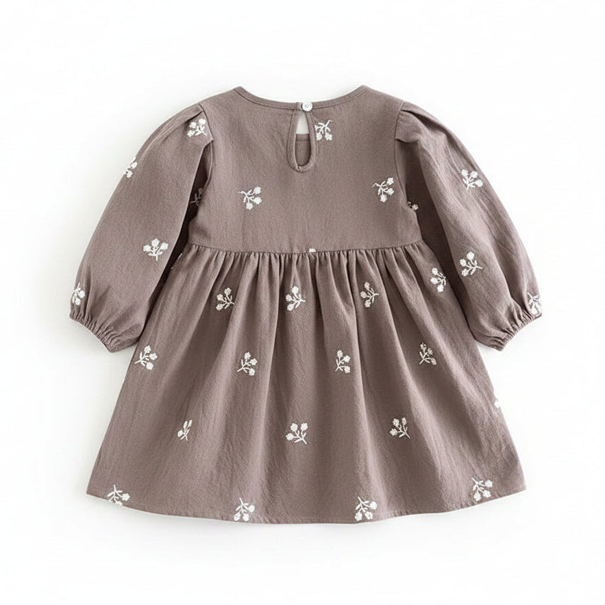 Back view of the gray floral cotton girls dress showing the simple back keyhole button closure.