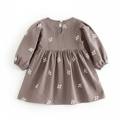 Back view of the gray floral cotton girls dress showing the simple back keyhole button closure.