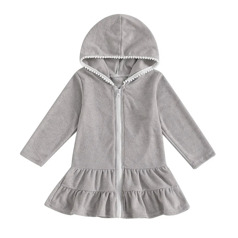 Heather grey girls' hooded zip-up swim coverup with long sleeves and decorative white pom-pom trim on the hood.
