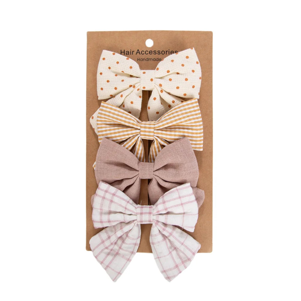Kidsely Heirloom Mustard set of 4 large linen hair bows featuring mustard stripes, ivory dots, and pink plaid.