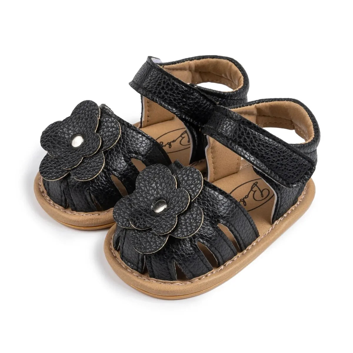 Black flower sandals for infant girls, perfect for dressy occasions and weddings, with non-slip grip.
