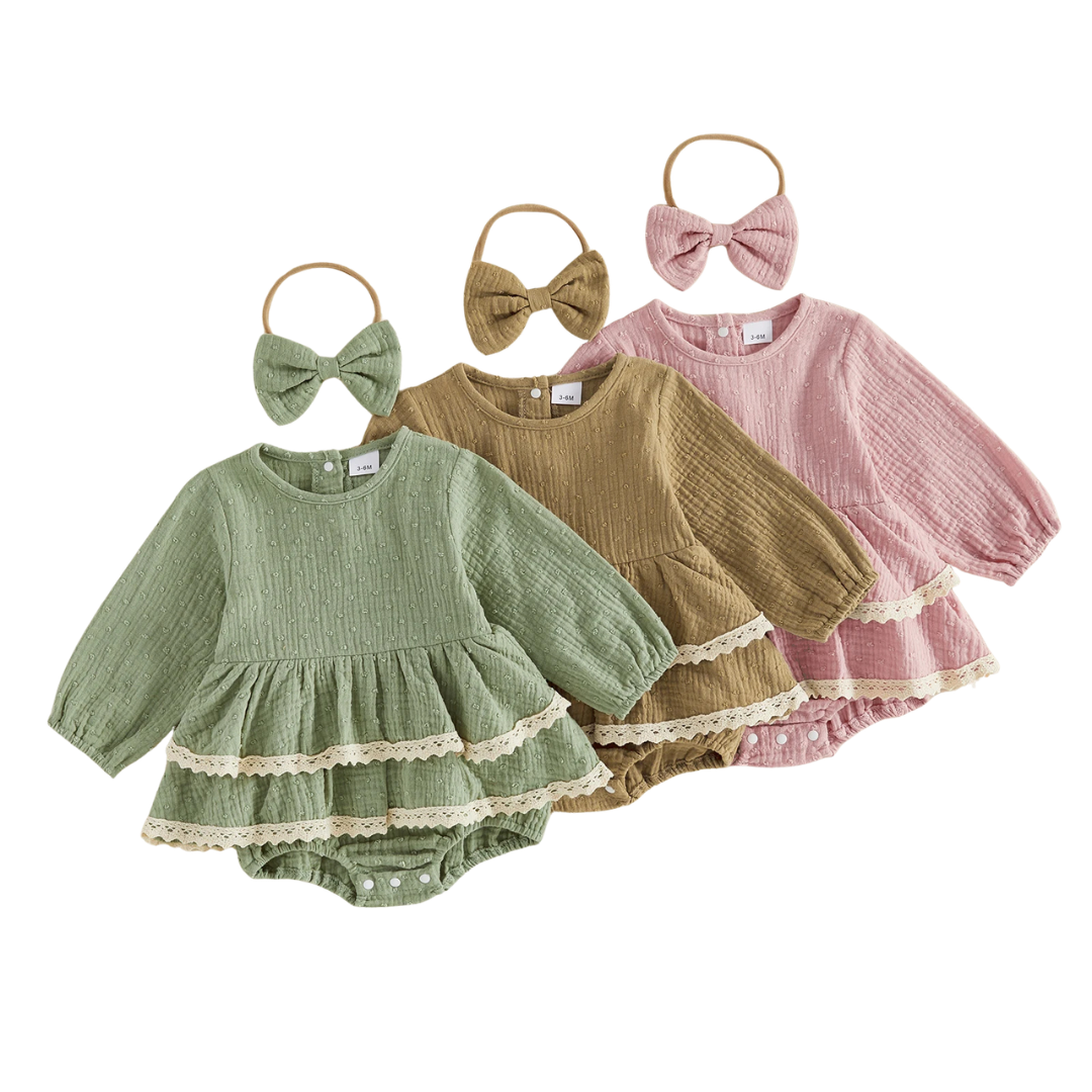 Three baby girl lace trim long sleeve rompers in sage green, mustard brown, and dusty pink arranged together with matching headbands.