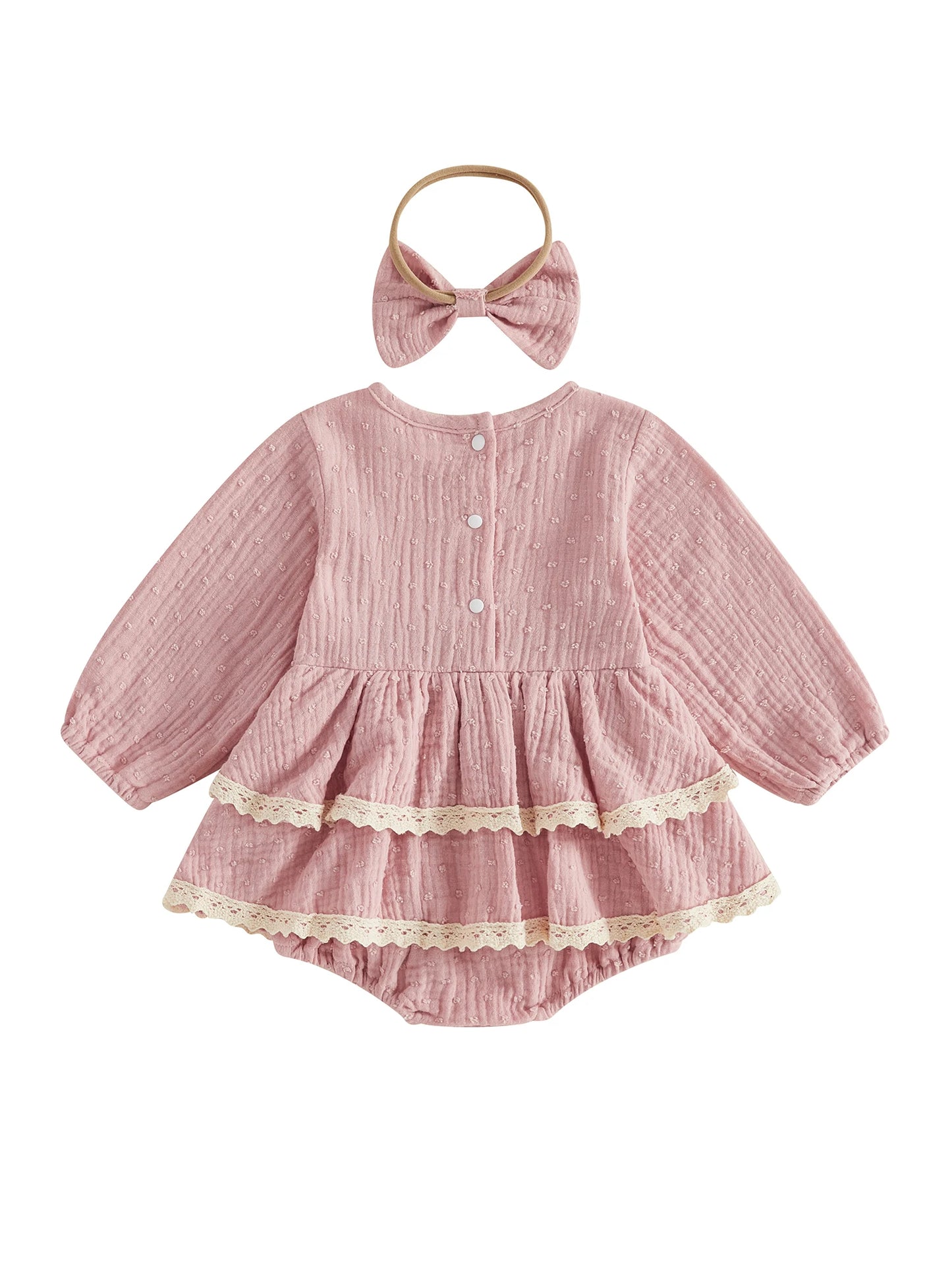 Back view of dusty pink long sleeve baby girl romper dress with double lace trim and matching headband on a white background.