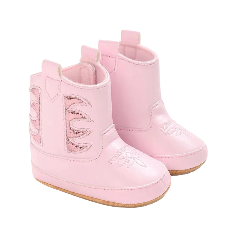 A pair of pink infant baby girl cowboy boots featuring metallic side panels and rubber soles on a white background.