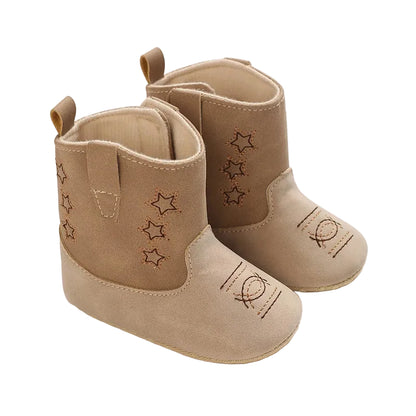 A pair of two-tone beige infant soft sole cowboy boots with star embroidery on a white background.