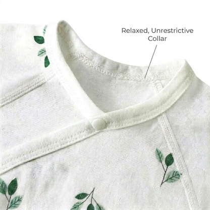 Close-up view of the wrap-style V-neck opening on the baby bodysuit, pointing out the relaxed, unrestrictive collar design.