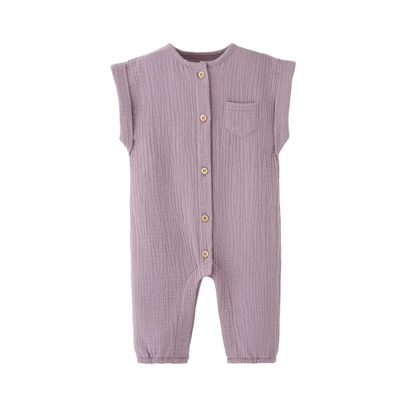 Front view of the vintage-inspired infant jumpsuit in a soft lavender purple, featuring a rolled cap sleeve and rustic buttons.
