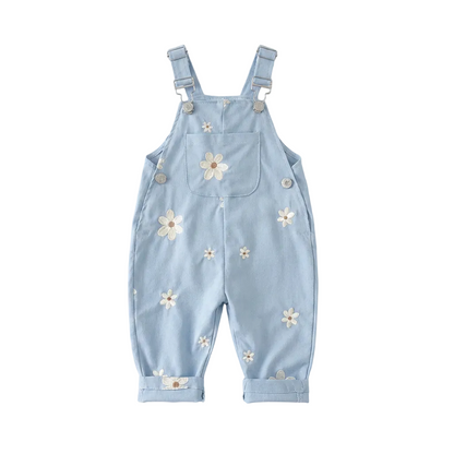 Light blue Kidsely toddler overalls featuring embroidered white daisies and a front chest pocket, displayed flat against a white background.