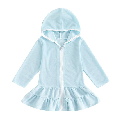 Light blue hooded zip-up beach robe for toddlers and little girls with long sleeves and white pom-pom detail.
