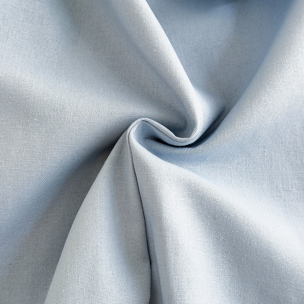 Close-up macro shot showing the soft, durable weave of the light blue fabric used for Kidsely toddler overalls.
