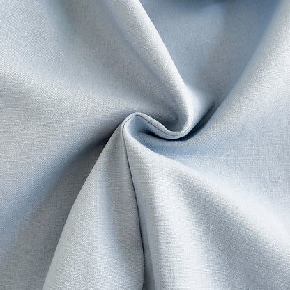 Close-up macro shot showing the soft, durable weave of the light blue fabric used for Kidsely toddler overalls.