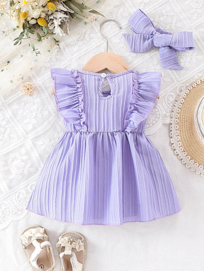 Back view of the light purple baby dress on a hanger, demonstrating the convenient back-button closure for easy dressing.