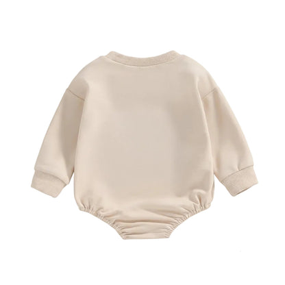 Back view of the plain neutral beige Little Bean long sleeve cotton baby bubble romper.