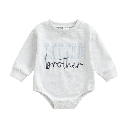 Light grey long-sleeve baby boy bubble romper featuring a blue and navy Little Brother graphic on a white background.