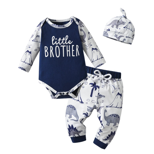3-piece little brother dinosaur outfit for baby boys laid flat on a white background, featuring a navy blue long-sleeve bodysuit, patterned pants, and a matching beanie hat.