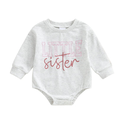 Light gray long-sleeve baby girl bubble romper featuring a pink Little Sister graphic on a white background.
