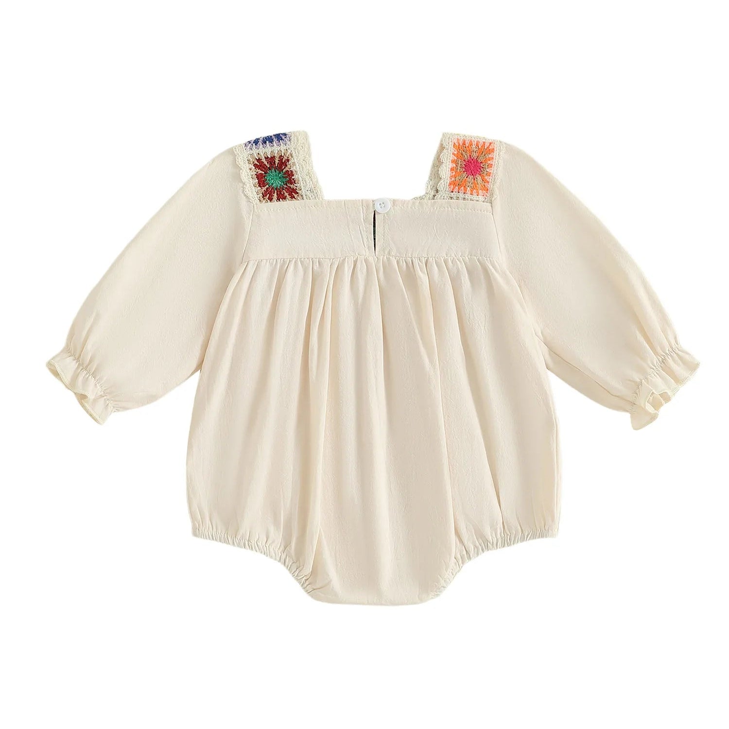 Full back view of the beige cotton-blend baby bodysuit showing the plain fabric layout with colorful crochet shoulder patches.