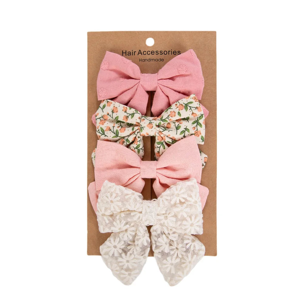 Kidsely Meadow Bloom set featuring 3.5 inch pink solid, leafy floral, peach linen, and white daisy lace bows.